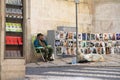 The street artist will sell their own work on street Lisbon (Portugal). Royalty Free Stock Photo