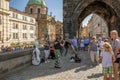 Street artists performing at the Charles Bridge in Prague Royalty Free Stock Photo