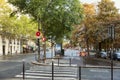 Street in the autumn city with a pedestrian crossing and a beautiful park. Paris, France, 10-09-2019 Royalty Free Stock Photo