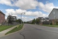 Street with autumn clouds on blue sky