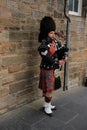 The street bagpiper in the city Edinburgh in Scotland. Royalty Free Stock Photo