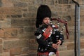 The street bagpiper in the city Edinburgh in Scotland. Royalty Free Stock Photo