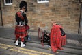 The street bagpiper in the city Edinburgh in Scotland. Royalty Free Stock Photo