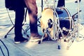 Street musicians, kick drum and drummer legs in action