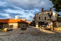 On the street of Bansko town with it`s authentic stone houses in Bulgarian ski resort in summer, Bulgaria.