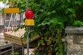 Street barricade with warning signal lamp on a fence