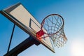 Street basketball hoop on a sunny day with blue sky in the background. Urban youth game. Concept of success, scoring points and Royalty Free Stock Photo