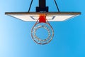 Street basketball hoop on a sunny day with blue sky in the background. Urban youth game. Concept of success, scoring points and Royalty Free Stock Photo