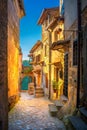 A street in a beautiful small medieval village in Tuscany at sunset