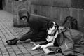 A street beggar earns money on tourists.