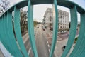 Street bhind green balustrade on the bridge Royalty Free Stock Photo