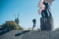 Street biker with a bike practicing free style and jumping at t Royalty Free Stock Photo