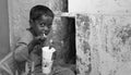 Street boy enjoying fizzy drink