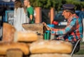 Street busker playing organette Royalty Free Stock Photo