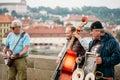 Street Buskers performing jazz songs on the Charles Bridge in Pr