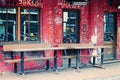 Street cafe in Amsterdam with graffiti on the shabby wall Royalty Free Stock Photo