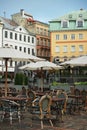 Street cafe with chairs and tables against the backdrop of the old city Royalty Free Stock Photo