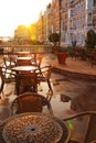 Street cafe early morning. Rising sun Royalty Free Stock Photo