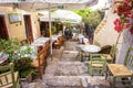 Street cafe with flowers and plants in Plaka district, Athens, G Royalty Free Stock Photo