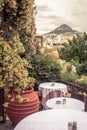 Street cafe with flowers and plants in Plaka district, Athens, G Royalty Free Stock Photo