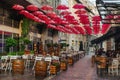 Street Cafe with Hanging Red Umbrellas