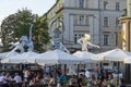 Street cafe located near the opera house with silhouettes of ballerinas on umbrellas