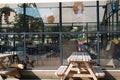 Street cafe in a modern black building in a sunny day