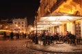 Street cafe on the old streets of the night city. Royalty Free Stock Photo