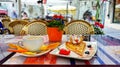 Tourism in Europa Street cafe table with cup of coffee and glass orange juice  and sweet strawberry cake travel to Europa Estonia Royalty Free Stock Photo