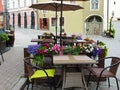 Street cafe table and  chair with beautiful flowers   in Old town of Tallinn Travel to Estonia tourism in Europa Royalty Free Stock Photo