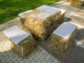 Street cafe table made of straw bales