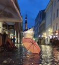 Night City Lights Rainy Season weather Tallinn Old Town Square Autumn evening in city street bokeh light  rainy night  umbrella Royalty Free Stock Photo