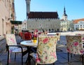 Street Cafe, tables and chairs in the city are waiting for people to rest and have a cup of coffee in Europe. Baltic Old Town of Royalty Free Stock Photo