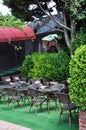 Street Cafe. Tables and chairs on a green synthetic carpet. Royalty Free Stock Photo