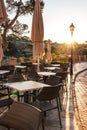 Street in Cala Figuera, Mallorca. Empty sidewalk cafe or restaurant in morning sunrise