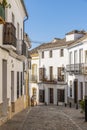 Street with typical residential buildings Ronda Spain