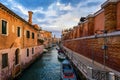 Street canal in Venice, Italy. Narrow canal among old colorful brick houses in Venice, Italy. Venice postcard Royalty Free Stock Photo