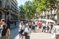 Street caricaturist painter working at La Rambla street. Las Ramblas is one of the most famous streets in the city Royalty Free Stock Photo