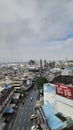 street, cars, and cloudy sky