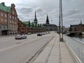 Street with cars next to the former stock exchange building in Copenhagen, Denmark