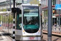 Street cars Trams of the RET in Rotterdam on the streets type Citadis in the Netherlands with buildings and scyscraper