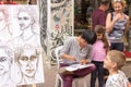 Street cartoonist draws a caricature