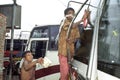 Street children polish buses on Bus Station Dhaka