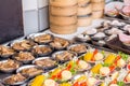 Street Chinese appetizer. Variety of dumplings or dim sum on the small metal plate