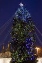 Street city Christmas tree at night. The garlands are burning. Holiday decorations and toys. Garland of lights. Royalty Free Stock Photo