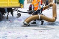 Street cleaner with industrial vacuum cleaner. Municipal cleaning service, clean streets. Royalty Free Stock Photo