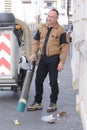 Street cleaner vehicle and worker on road Royalty Free Stock Photo