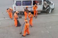 Street cleaners sweeping sidewalk