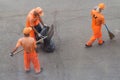 Street cleaners sweeping sidewalk