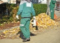 Street cleaners work in autumn Royalty Free Stock Photo